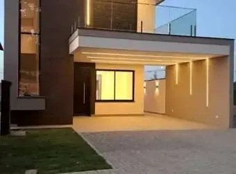 Projeto da fachada de uma casa com a garagem iluminada
